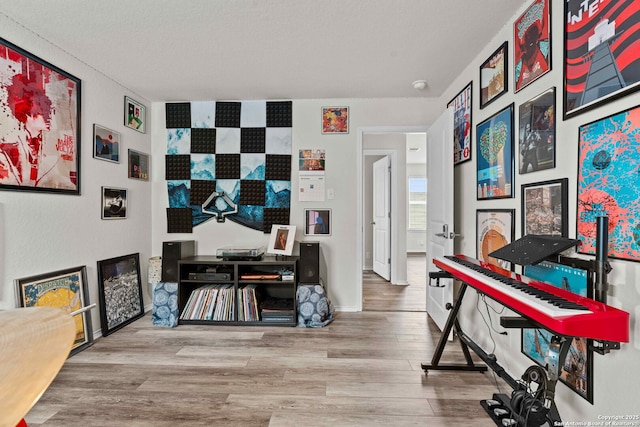 home office featuring light wood-type flooring and baseboards