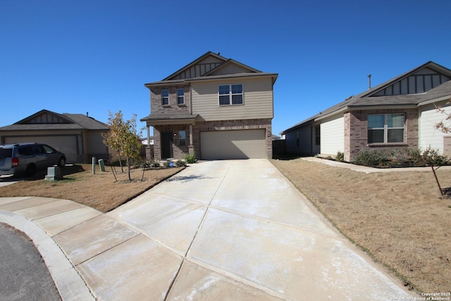 craftsman house with driveway, a garage, board and batten siding, and brick siding