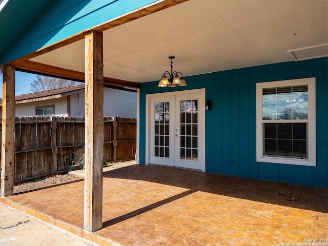 view of patio / terrace featuring french doors and fence