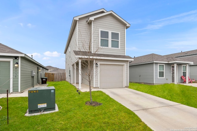 view of front of property featuring an attached garage, driveway, a front lawn, and fence