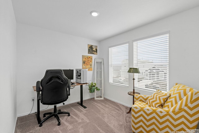 carpeted office with baseboards