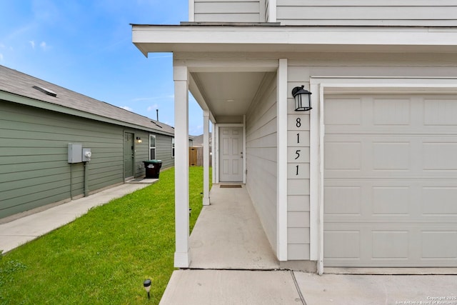 entrance to property with a yard