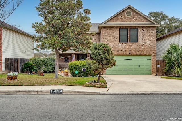 traditional-style house with concrete driveway, brick siding, fence, and an attached garage