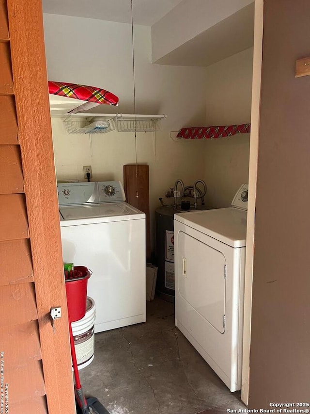 washroom featuring laundry area and washing machine and dryer