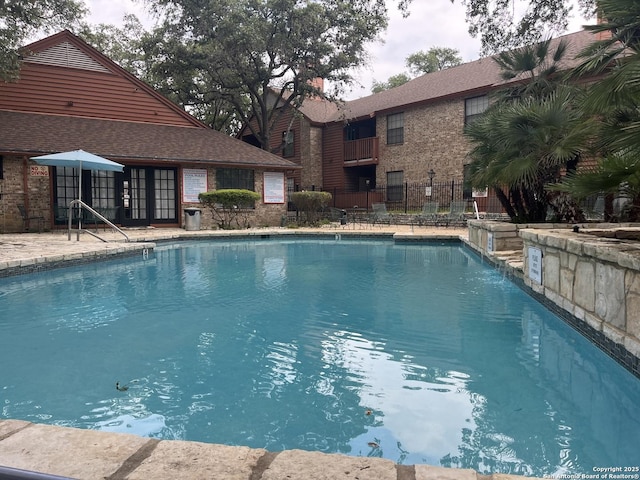 community pool with fence