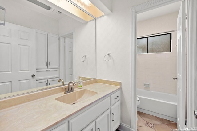 full bathroom with shower / washtub combination, vanity, toilet, and tile patterned floors