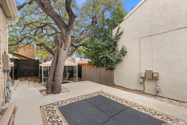 view of patio / terrace with a gazebo and fence