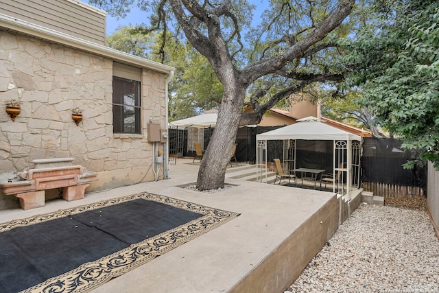 view of patio / terrace with a gazebo and fence