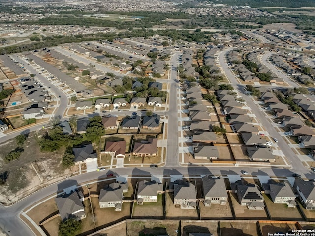 birds eye view of property with a residential view