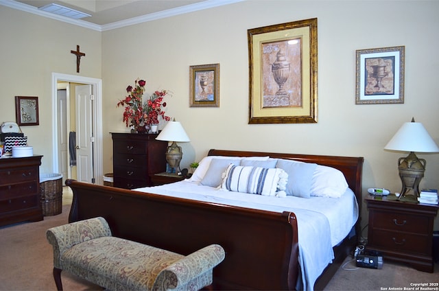 bedroom featuring carpet flooring, crown molding, and visible vents