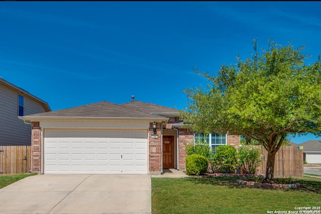 view of front facade featuring driveway, brick siding, a front lawn, and fence