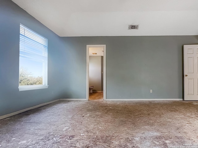 spare room with visible vents and baseboards