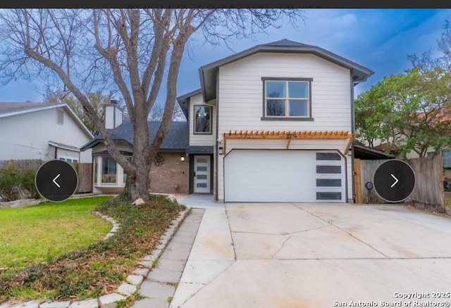 view of front facade with an attached garage, brick siding, fence, driveway, and a front lawn