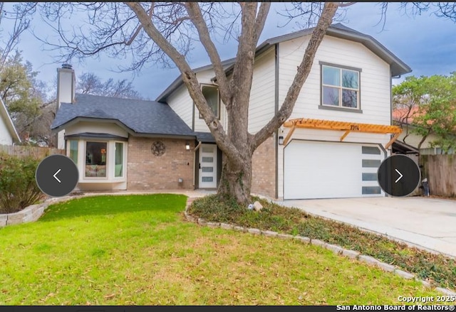 view of front of house featuring a chimney, fence, a front lawn, and brick siding