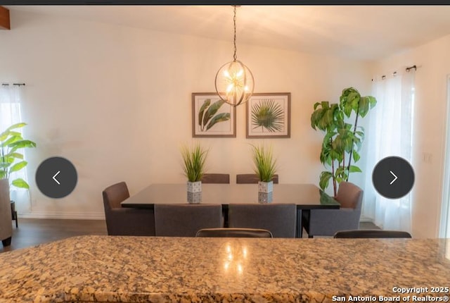 dining space featuring a notable chandelier