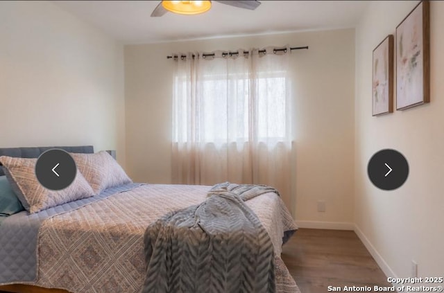 bedroom with ceiling fan, baseboards, and wood finished floors