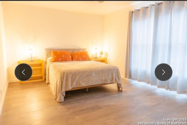 bedroom featuring wood finished floors