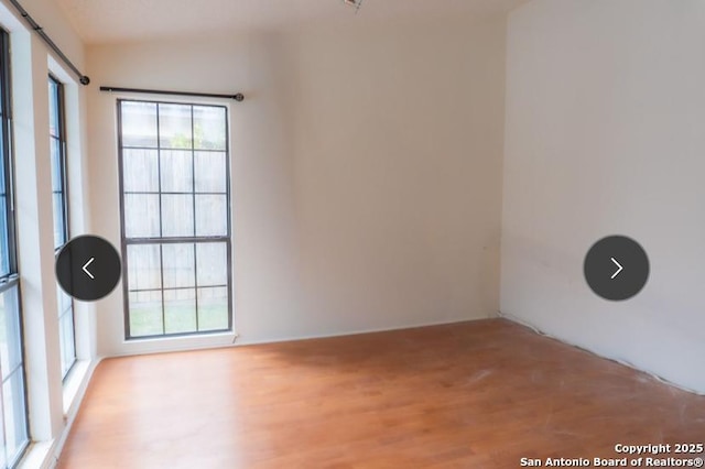 unfurnished room featuring light wood-style flooring