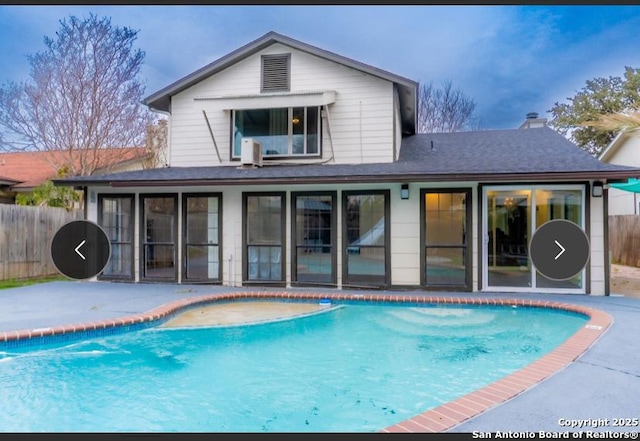 view of swimming pool with a patio, fence, and a fenced in pool