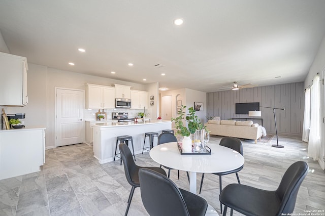 dining room with a ceiling fan and recessed lighting