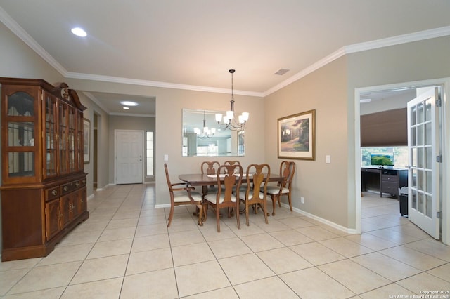 dining space with light tile patterned flooring, crown molding, a notable chandelier, and baseboards