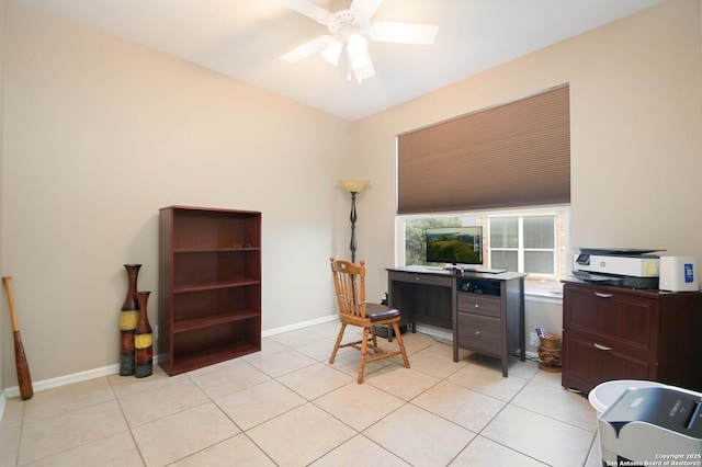 office space featuring ceiling fan, baseboards, and light tile patterned floors