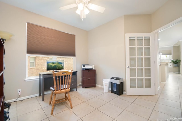 home office with light tile patterned floors, a ceiling fan, and baseboards