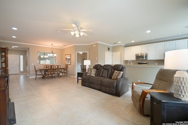 living area featuring light tile patterned floors, baseboards, crown molding, and recessed lighting