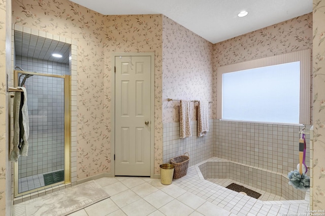 bathroom featuring tile patterned flooring, a shower stall, and wallpapered walls