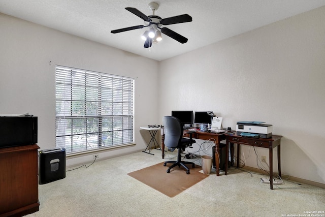 carpeted office with ceiling fan