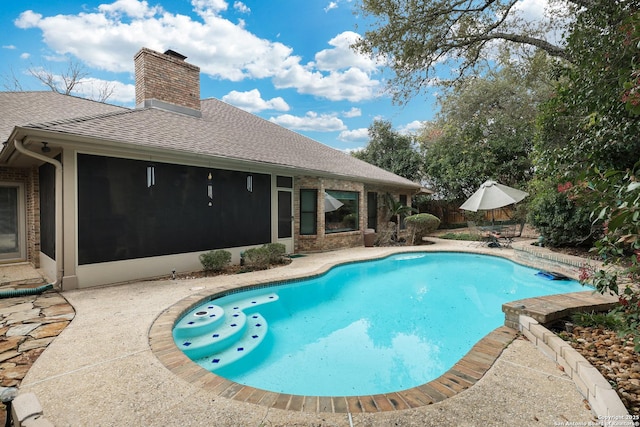 outdoor pool featuring a patio