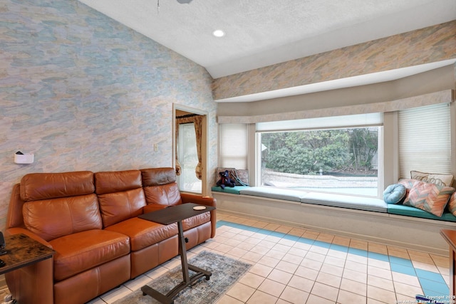 living area with light tile patterned floors, vaulted ceiling, a textured ceiling, and recessed lighting