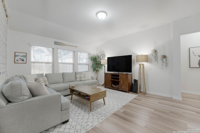 living room featuring light wood finished floors and baseboards