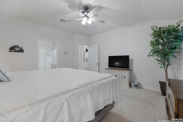 bedroom with baseboards, visible vents, light colored carpet, ceiling fan, and vaulted ceiling