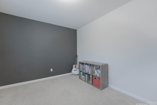 rec room with carpet flooring and baseboards