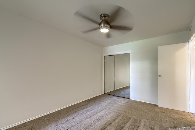 unfurnished bedroom featuring a closet, carpet, and a ceiling fan