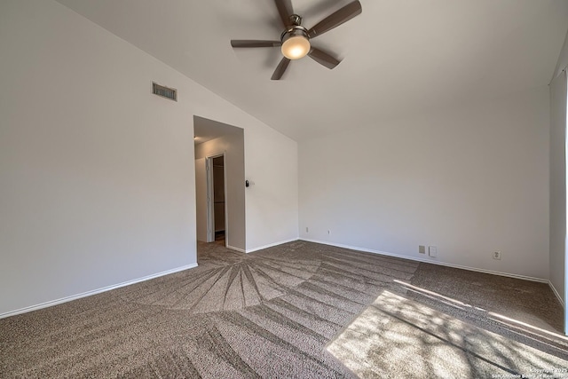 unfurnished room featuring ceiling fan, carpet flooring, visible vents, baseboards, and vaulted ceiling