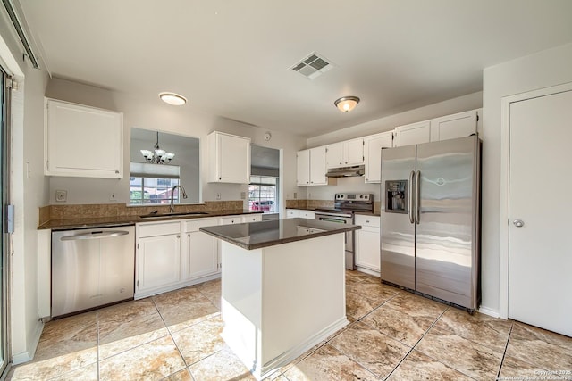 kitchen featuring dark countertops, visible vents, appliances with stainless steel finishes, and white cabinets