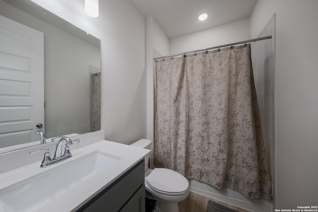 full bathroom featuring vanity and toilet