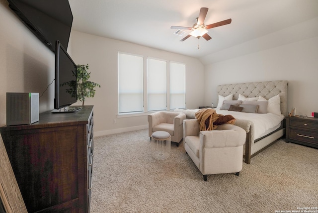 bedroom featuring light carpet, visible vents, baseboards, a ceiling fan, and vaulted ceiling