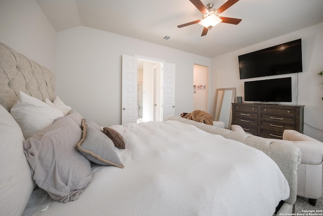 bedroom featuring vaulted ceiling, visible vents, and a ceiling fan