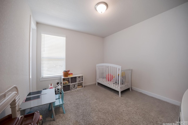 bedroom with carpet and baseboards