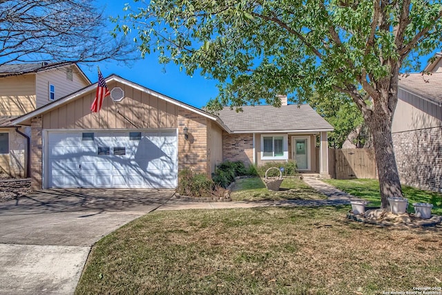 single story home with brick siding, an attached garage, fence, driveway, and a front lawn