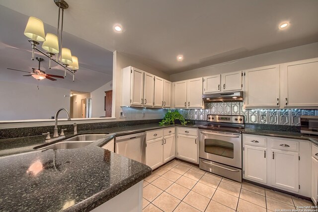 kitchen featuring under cabinet range hood, appliances with stainless steel finishes, a sink, and white cabinets