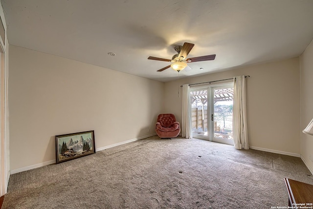 interior space featuring ceiling fan and baseboards