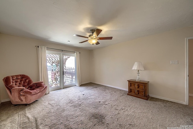 living area with carpet floors, ceiling fan, and baseboards