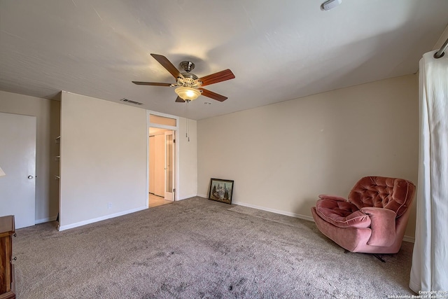 unfurnished room with baseboards, visible vents, ceiling fan, and light colored carpet