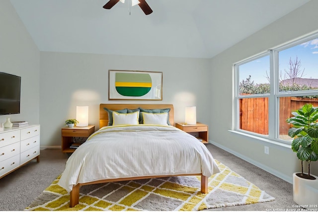 bedroom with lofted ceiling, carpet flooring, ceiling fan, and baseboards