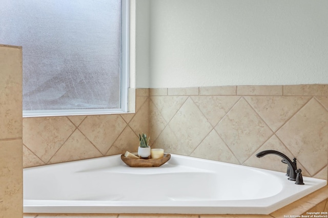 bathroom featuring a tub to relax in