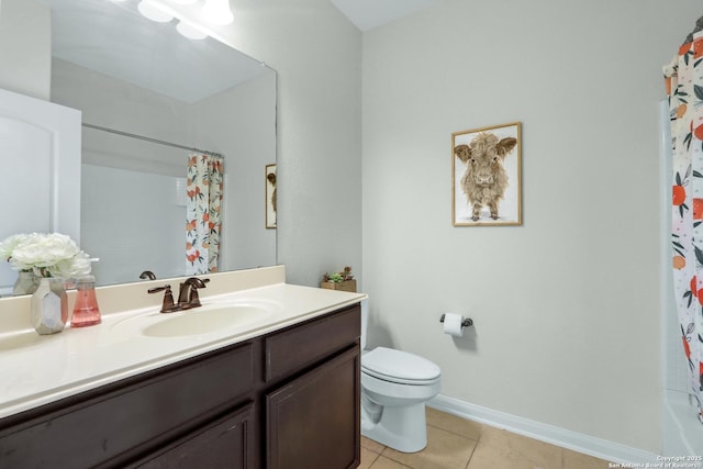 full bathroom featuring baseboards, vanity, toilet, and tile patterned floors